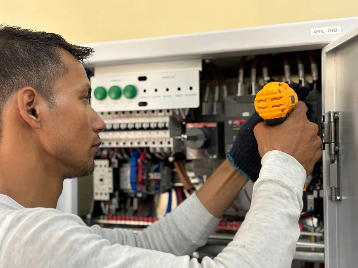 Electrician testing a residential distribution board
