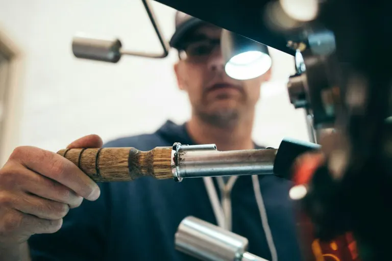 Technician brazing copper pipework on an MEP installation